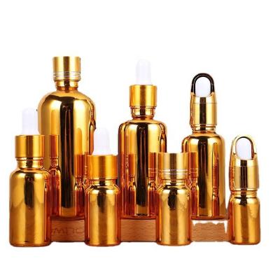 China Gold Plating Essential Oil Bottle Cosmetic Portable Dropper Dispenser Bottle Essential Oil Sealed Glass Spray Lotion Bottle for sale