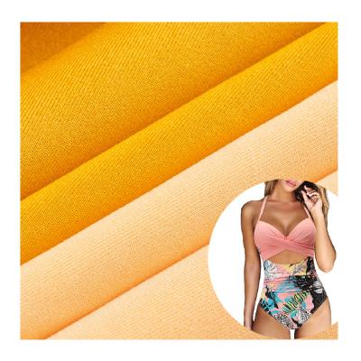 China Custom Color 88% Polyester 12% Spandex Polyester Swimming Fabric Flash Wind Proof Stretch Apparel Fabric For Swimwear Fabric for sale