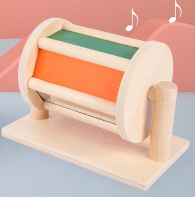 China Early Education Customized Educational Wooden Musical Rainbow Montessori Drum Spinning Toys with Bell for Baby Infant for sale