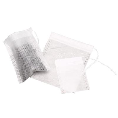 China Wholesale 100pcs Folding Heat Seal Tea Bags Nonwoven Fabrics Biodegradable Tea Bag With Strings for sale