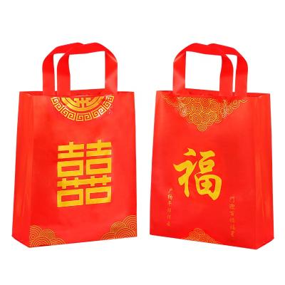 China Safety Chinese New Year Reusable Gift Bag Plastic Packaging Gift Packaging Bag For Wedding Holiday for sale