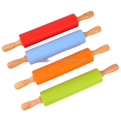 China Food Grade Viable Silicone Non-Stick Solid Wooden Handle Pin Flour Cake Baking Kitchen Tools for sale