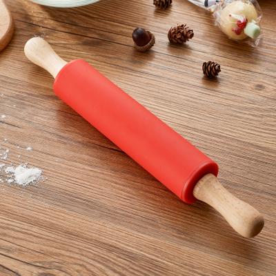 China Sustainable Food Grade Custom Kids Cake Rolling Tool Silicone Pin With Wooden Handle for sale