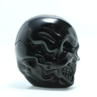 China Wholesale High Quality Natural Black Dichroism/Skulls Dichroic Crystal Carving Crafts For Decoration Obsidian for sale