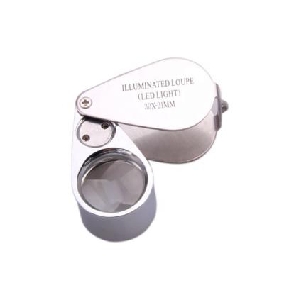 China Metal frame+acrylic lens 30x21 all metal illuminated jewelry loupe, handheld folding magnifying glass jewelers loupe with UV LED for sale