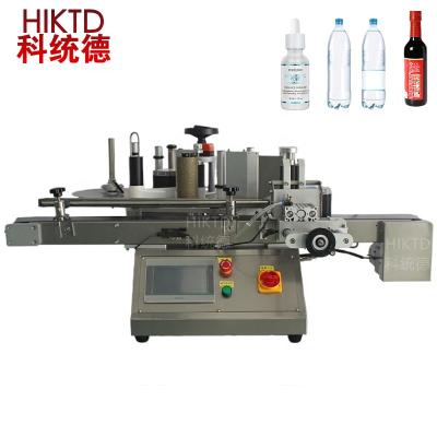 China Small Desktop CLOTHING Labeling Machine Positioning Round Bottle Round Bottle Labeling Labeling Machine for sale