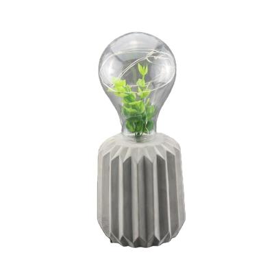 China Modern Plastic Light Bulb With Recessed Natural Vertical Stripes Cement Table Lamp Artificial Plant Pot for sale