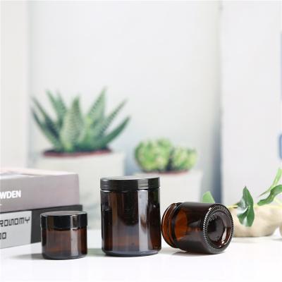 China Manufacturer New Design Brown Glass Cream Packaging Jar With Small Jars Round Shape Cosmetic Amber Black Glass Jar Container for sale