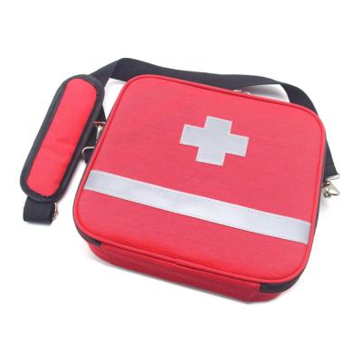 China Waterproof Reflect Cross 1680D Family Travel Light Red Reflective First Aid Kit Portable Backpack for sale