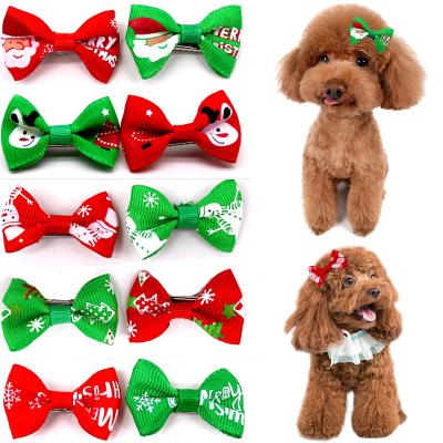 China Sustainable Wholesale Dog Bows Christmas Santa Yorkshire Terrier Grooming For Pets Supplies Grooming Hair Clips Table Bows for sale