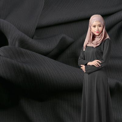 China Dubai polyester black turkey abaya dress 100% soft muslim crepe fabric Shrink-resistant Dubai black turkey abaya dress buzz crepe fabric for sale