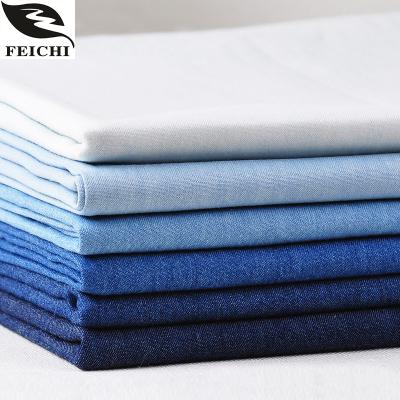 China Breathable Stock Chinese Material 10oz Washed 100% Cotton Twill Yarn Dyed Denim Fabric For Jeans for sale