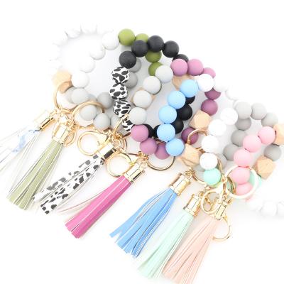 China 2023 Custom Wallet Key Chain Wristlet Key Chain Elastic Leather Tassel Silicone Beads Wristlet Key Chain for sale