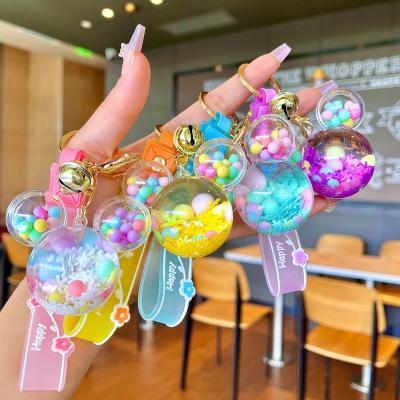 China Wholesale plastic small gift quicksand liquid bottle school bag pendant key chain for sale