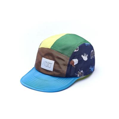 China COMMON Wholesale Manufacturer Fashion Waterproof Flat Overflow Nylon Wovel Flag 5 Panel Caps for sale