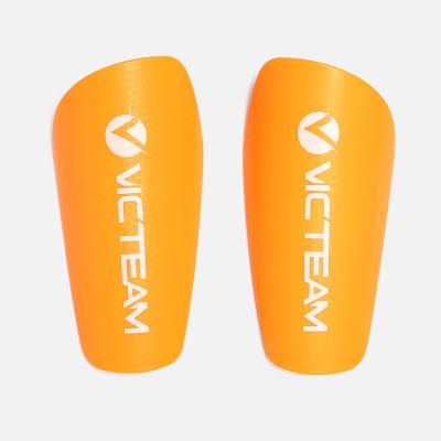 China Outdoor Soccer Shin Pads, Eva Foam Kids Training Soccer Shin Guards In Bulk Durable Cheap Orange Honeycomb for sale