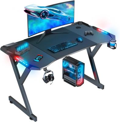 China Gaming Desk With Ergonomic Design Carbon Fiber Finish LED Lights Convenient Accessories For Living Spaces Or Gamers for sale