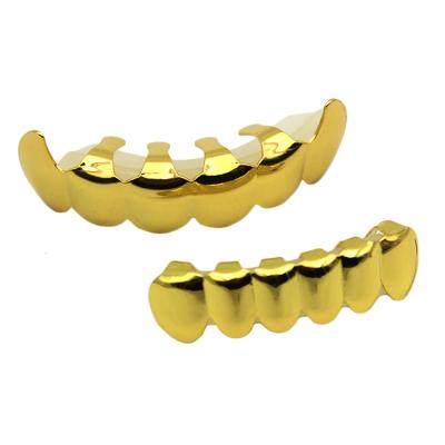 China Hiphop Hiphop Gold Color Teeth Grillz Top and Bottom Grill Set with Silicone Vampire Fangs Body Jewelry for sale