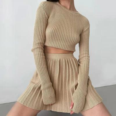 China Anti-wrinkle knitwear manufacturer fall round necked sleeved long ribbed knitted sweater pleated skirt sweater set for women for sale