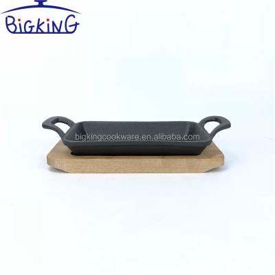 China Sustainable Mini Oval Cast Iron Pan 10*17*2.5cm With Bamboo Tray for sale