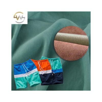 China Multiple Blackout Function Polyester Fabric Peach Skin 100% Microfiber For Beach Shorts Cloth Men for sale