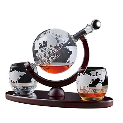 China Luxury Globe 850ml Wooden Base Etched Clear Crystal Glass Rotating Whiskey Globe Decanter Set With 2 Ship Map Glasses for sale