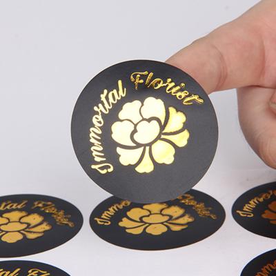 China Niche waterproof custom brand factory production self-adhesive gold paper sticker makeup roll self-adhesive waterproof printing synthetic leaflet for sale