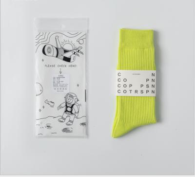 China Yuansufeng sports Japanese street socks solid color fluorescent medium tube jars men and women's sports skateboard cotton stockings for sale