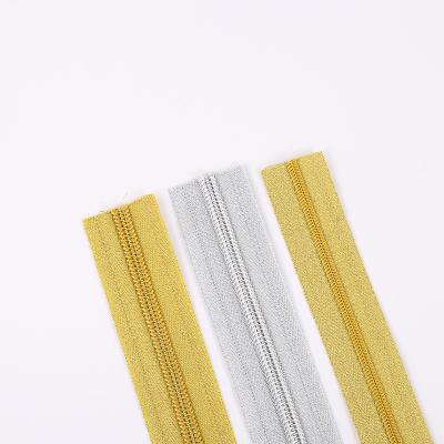 China Auto Lock Gold Silver Teeth Auto Lock Zipper Tape Eco - Friendly Long Chain Nylon for sale