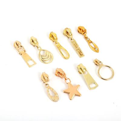 China Other Factory Direct Sales DIY Sewing Accessories Light Gold Metal Zipper Puller #5 for sale