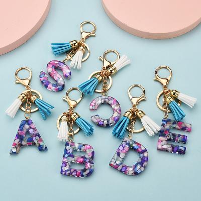 China Gift keychain or bag pendant fashion 26 letter english metal key chain clear acrylic crystal tassel pendant bag custom rubber woodkeychain pendant for sale