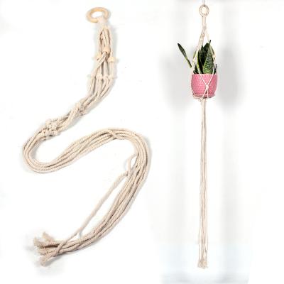 China Bohemian wholesale handcraft cotton rope macrame plant hangers à venda