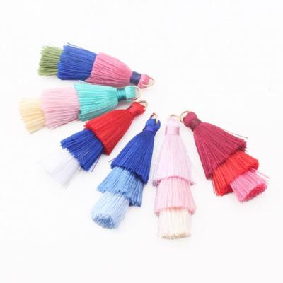 China Custom size newest trend design 3 layers cotton tassels with ring on top for jewelry decoration Te koop