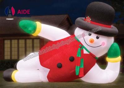 China Strong Oxford Cloth Lying Inflatable Snowman , Inflatable Cartoon Character With Light for sale