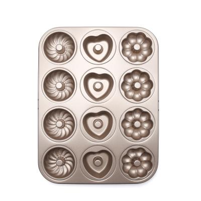 China Reuseful Sustainable Carbon Steel 12 Cavity Liner Bakeware Heat Resistant Donut Pan Cupcake Mold for sale