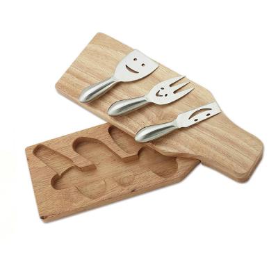 China Sustainable Smiling Face Acacia Cheese Wooden Board With Knife Set Stainless Steel Cheese Knives for sale