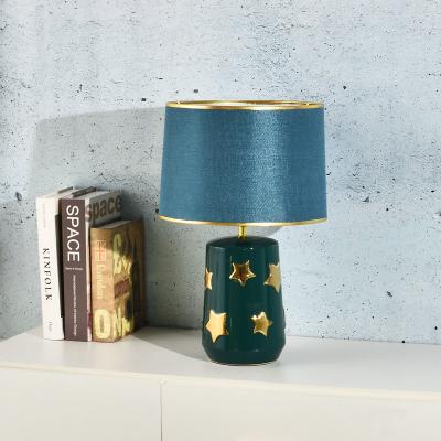 China 2022 modern new electroplating green background and gold star ceramic table lamp for hotel decoration for sale