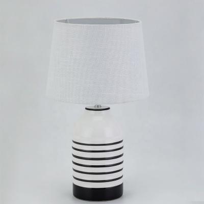 China New arrival black line modern painting living room white ceramic bedroom decorative table lamp for sale