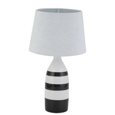 China Newest modern black line painting hotel white ceramic bedside decorative table lamp for sale