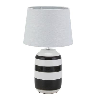 China Modern hot sale funky black line white ceramic paint hotel living room bedroom table lamp for sale