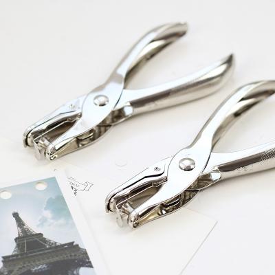 China Manual Punch Paper Creative Paper Hand Holding Single Hole Puncher Binding Parts for sale