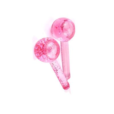 China Best Selling Pink Face Beauty Anti-Puffiness Massager Ice Cold Magic Cooling Facial Globes Ball Roller for sale