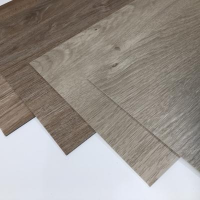 China Ultra-Thin Design Style Waterproof Herringbone LVT SPC Vinyl Tiles for Sports Venues for sale