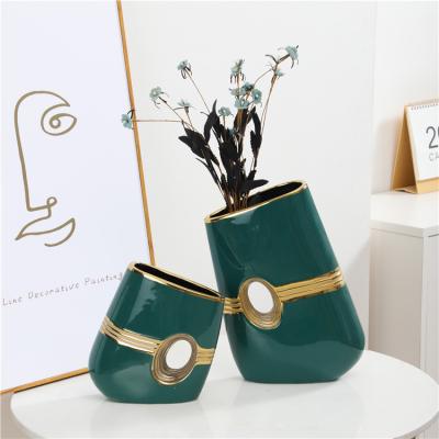 China Minimalist high-grade green gold hollow out pieces home office porcelain decoration ceramic flower vase for sale