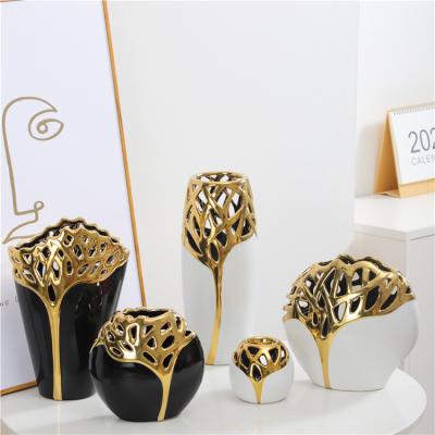 China Flower Vase Hotel Ornament Minimalist Decorative Hollow Black Gold Table Top Luxury Ceramic White for sale