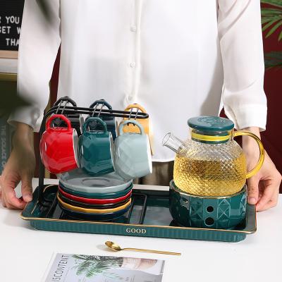 China Viable Royal Scented Tea Glass Teapot Set Colored Ceramic Coffee Cup And Saucer Gold Rim Luxury Porcelain Tea Sets With Glass Teapot for sale