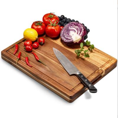 China Kitchen Sustainable Vegetable Fruit Mold Proof Household Wooden Cutting Board Acacia Chopper With Grooves for sale