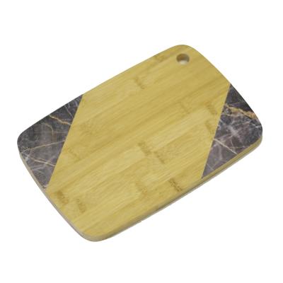 China WholesaleKitchen Sustainable Accessory Natural Bamboo Cutting Board Rectangle Shape With Beautiful Pattern Cutting Plates With Hole for sale