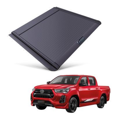 China Tailbox Car Parts Roll Cover Up Pick Up Truck Aluminum Alloy Tonneau Cover For Toyota Revo 2015+ for sale