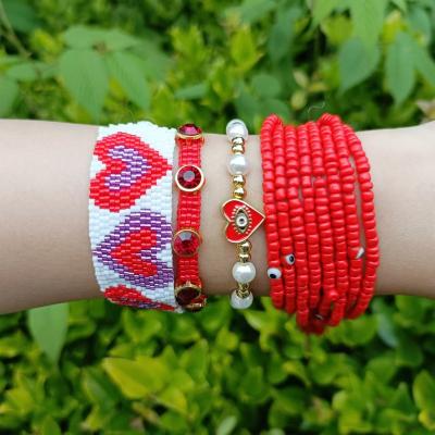 China Miyuki Hand Heart Bracelet Set European and American Bohemian Bohemian Multilayer Pearl Rice Beads Devil's Eye Zircon Bead Bracelet for sale